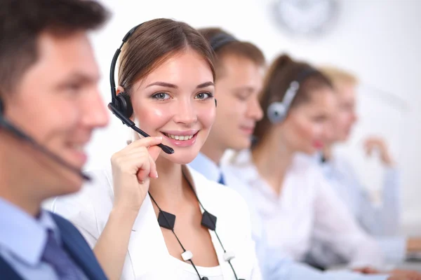 Attractive Smiling positive young businesspeople and colleagues in a call center office — Stock Photo, Image