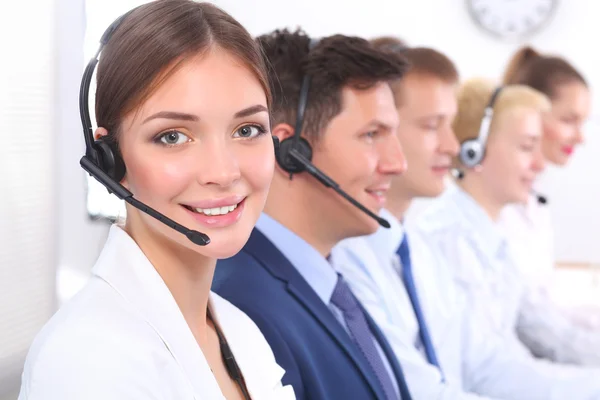 Attractive Smiling positive young businesspeople and colleagues in a call center office — Stock Photo, Image