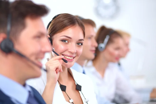 Attractive Smiling positive young businesspeople and colleagues in a call center office — Stock Photo, Image