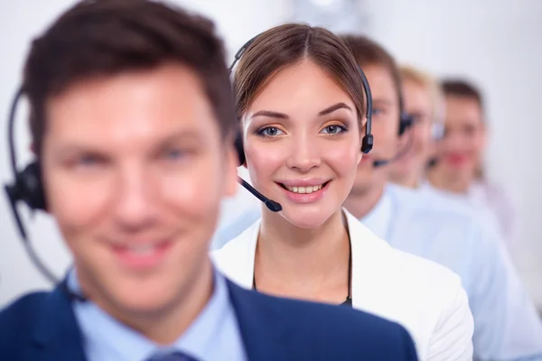 Attractive Smiling positive young businesspeople and colleagues in a call center office — Stock Photo, Image