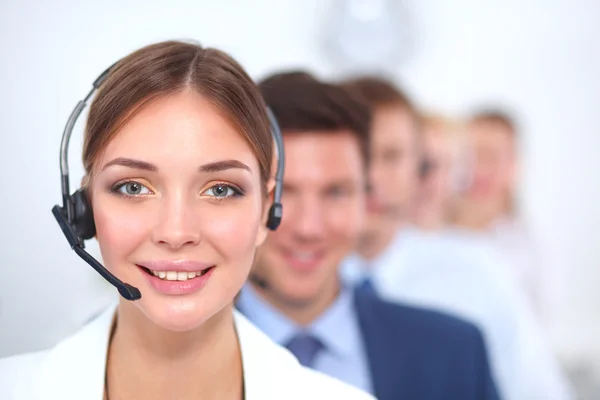 Attractive Smiling positive young businesspeople and colleagues in a call center office — Stock Photo, Image