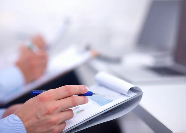 Business people sitting and writting at business meeting, in office — Stock Photo, Image