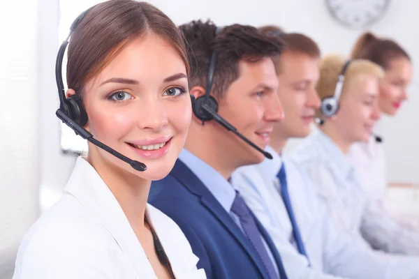 Attractive Smiling positive young businesspeople and colleagues in a call center office — Stock Photo, Image