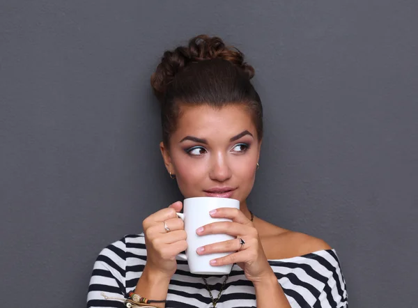 Portrait  a young woman with cup of tea or coffee — Stock Photo, Image