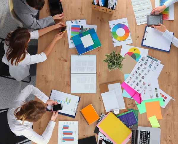 Business people sitting and discussing at business meeting, in office — Stock Photo, Image