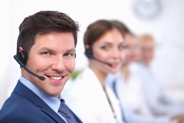 Attractive Smiling positive young businesspeople and colleagues in a call center office — Stock Photo, Image