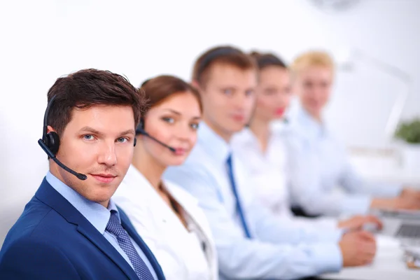 Attractive Smiling positive young businesspeople and colleagues in a call center office — Stock Photo, Image