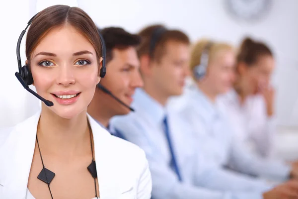 Attractive Smiling positive young businesspeople and colleagues in a call center office — Stock Photo, Image