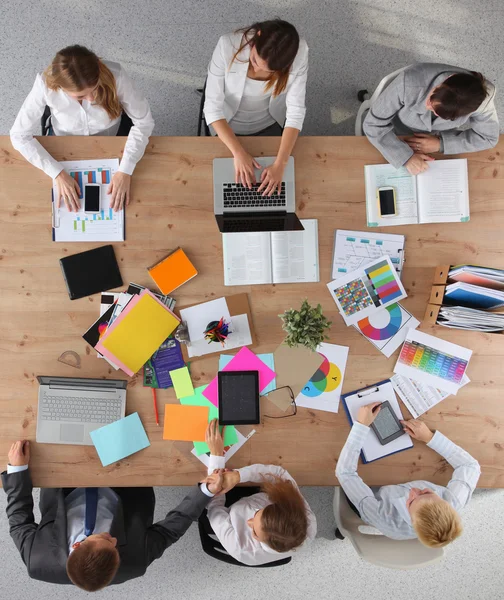 Business people sitting and discussing at business meeting, in office — Stock Photo, Image