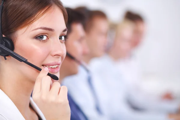 Attractive Smiling positive young businesspeople and colleagues in a call center office — Stock Photo, Image