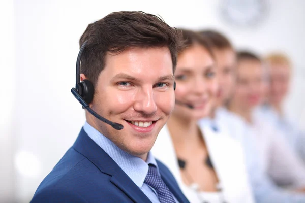 Attractive positive young businesspeople and colleagues in a call center office — Stock Photo, Image