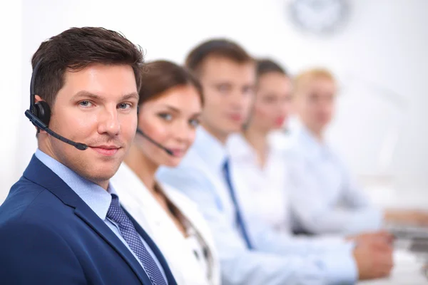 Attractive positive young businesspeople and colleagues in a call center office — Stock Photo, Image