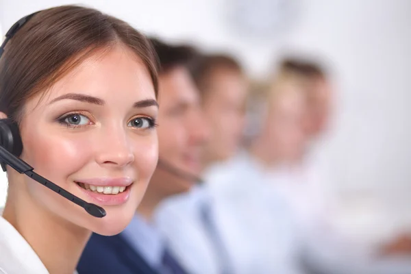 Attractive positive young businesspeople and colleagues in a call center office — Stock Photo, Image