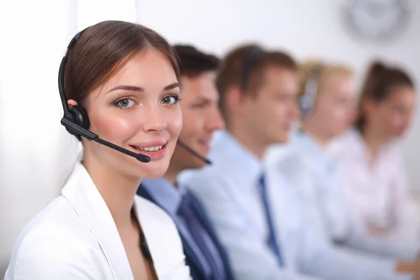 Attractive positive young businesspeople and colleagues in a call center office — Stock Photo, Image