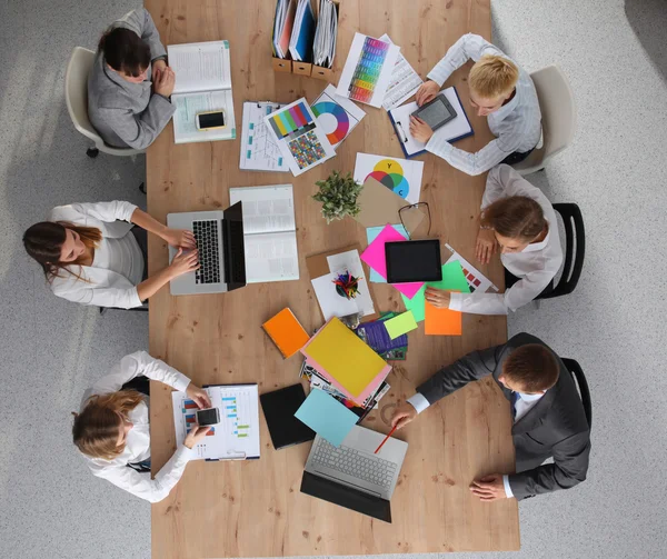 Business people sitting and discussing at business meeting, in office — Stock Photo, Image