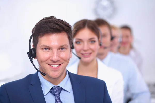 Attractive Smiling positive young businesspeople and colleagues in a call center office — Stock Photo, Image