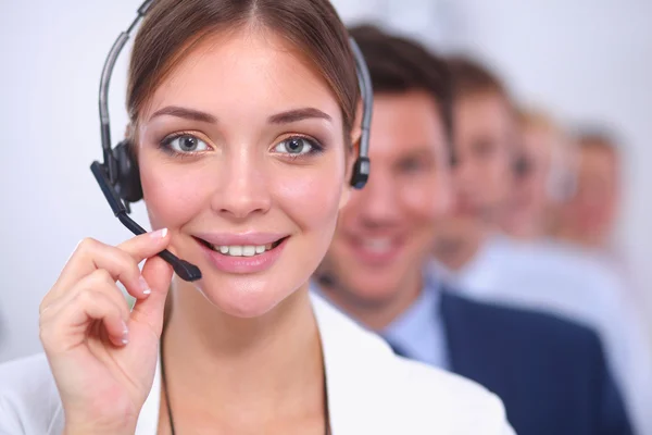 Attractive Smiling positive young businesspeople and colleagues in a call center office — Stock Photo, Image