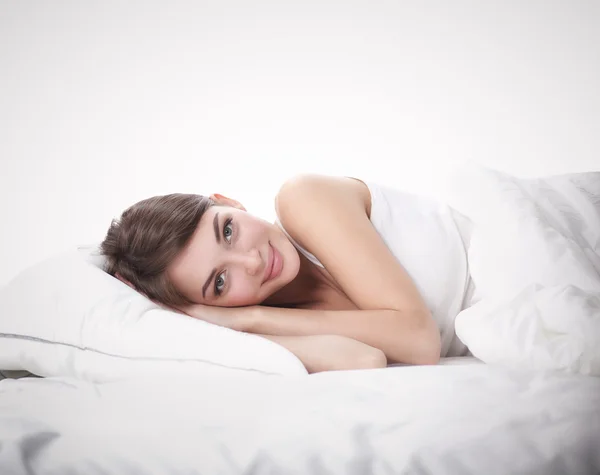 Beautiful girl lying in bedroom at early morning — Stock Photo, Image