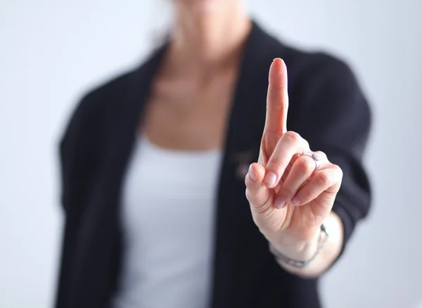 Frau berührt imaginären Bildschirm mit dem Finger - isoliert — Stockfoto