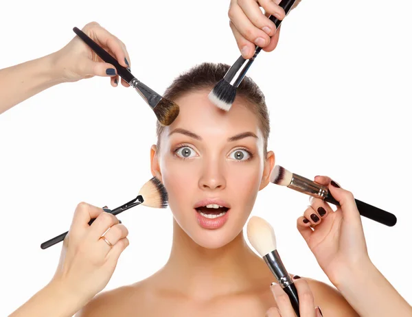 Closeup portrait picture of beautiful woman with brushes — Stock Photo, Image