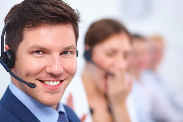 Attractive Smiling positive young businesspeople and colleagues in a call center office — Stock Photo, Image