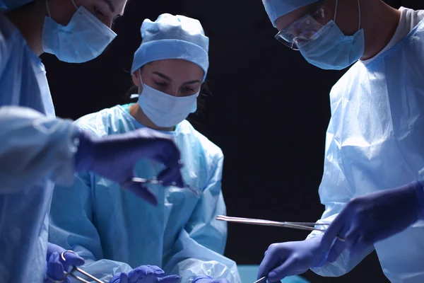 Team surgeon at work in operating room. — Stock Photo, Image