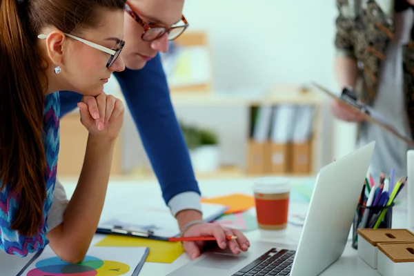 Young business people working at office on new project — Stock Photo, Image