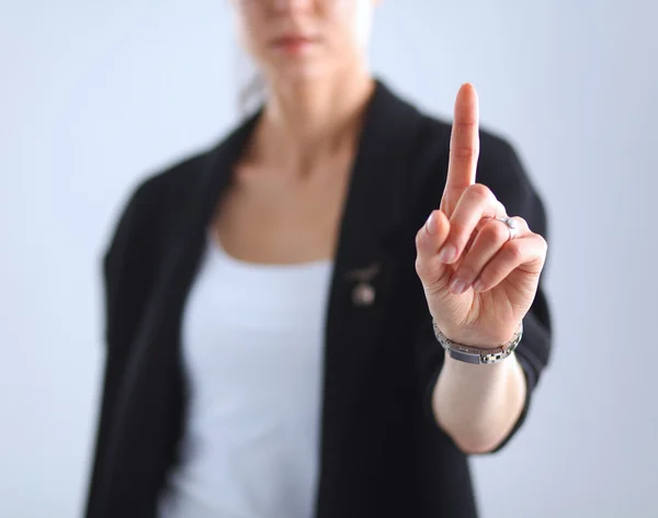 Kobieta dotykająca wyimaginowanego ekranu palcem — Zdjęcie stockowe