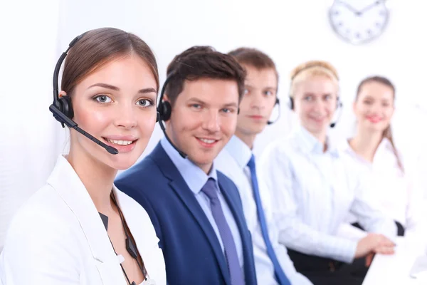 Attractive Smiling positive young businesspeople and colleagues in a call center office — Stock Photo, Image