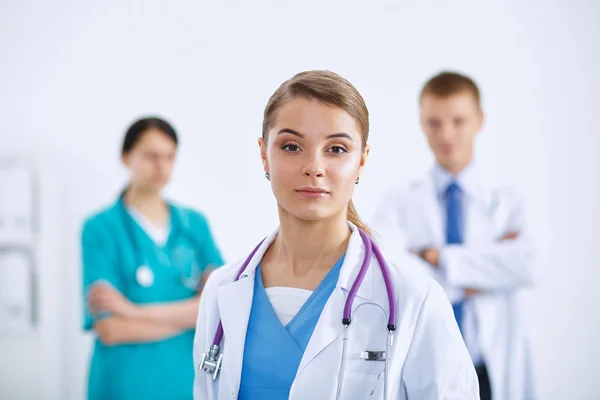 Woman doctor standing with stethoscope at hospital — Stock Photo, Image