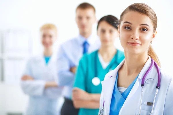 Woman doctor standing with stethoscope at hospital — Stock Photo, Image