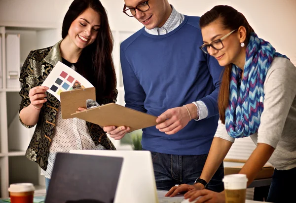 Young business people working at office on new project — Stock Photo, Image