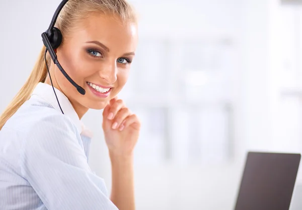 Close-up portrait of a customer service agent sitting at office — Stock Photo, Image