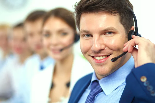 Attractive positive young businesspeople and colleagues in a call center office Stock Image