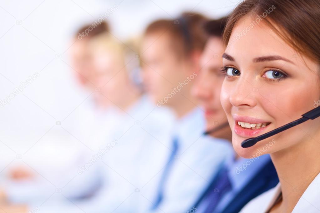 Attractive Smiling positive young businesspeople and colleagues in a call center office