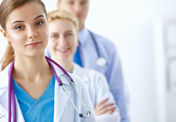 Woman doctor standing with stethoscope at hospital — Stock Photo, Image