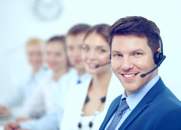 Attractive Smiling positive young businesspeople and colleagues in a call center office — Stock Photo, Image