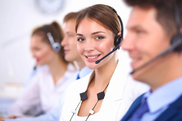 Attractive positive young businesspeople and colleagues in a call center office — Stock Photo, Image