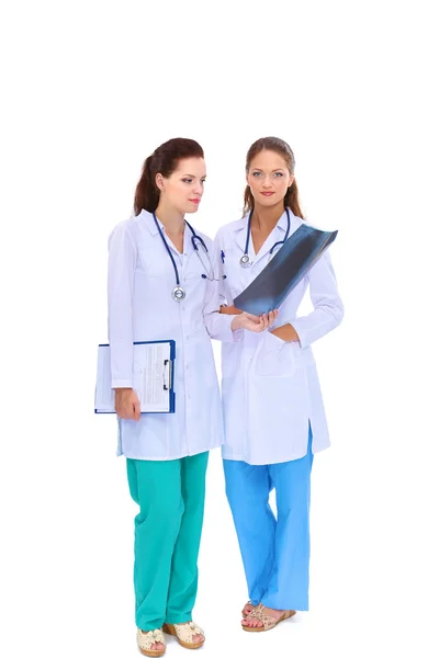 Two woman nurse watching X Ray image, standing in hospital — Stock Photo, Image