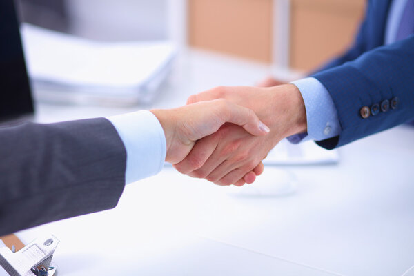 Business people shaking hands, finishing up a meeting