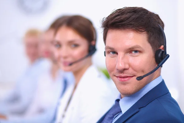 Attractive Smiling positive young businesspeople and colleagues in a call center office — Stock Photo, Image