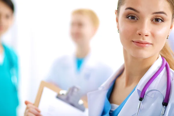 Woman doctor standing with stethoscope at hospital — Stock Photo, Image