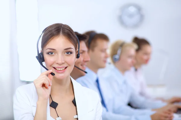 Attractive positive young businesspeople and colleagues in a call center office — Stock Photo, Image