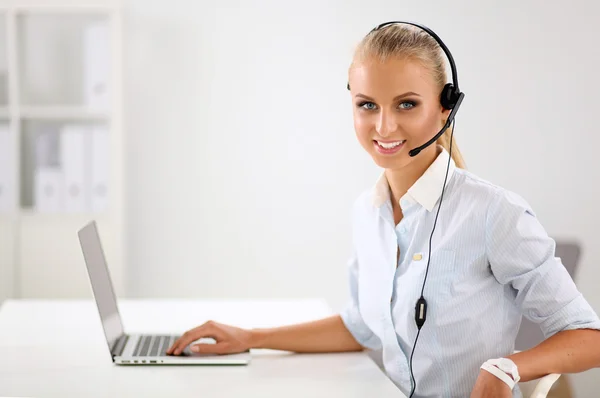 Portrait of a customer service agent sitting at office — Stock Photo, Image