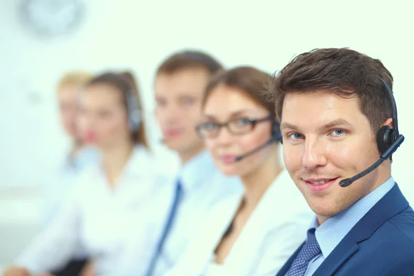 Attractive Smiling positive young businesspeople and colleagues in a call center office — Stock Photo, Image