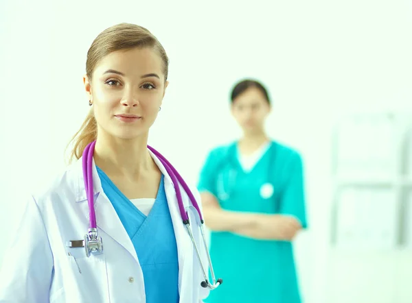 Woman doctor standing with stethoscope at hospital — Stock Photo, Image