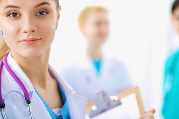 Woman doctor standing with stethoscope at hospital — Stock Photo, Image