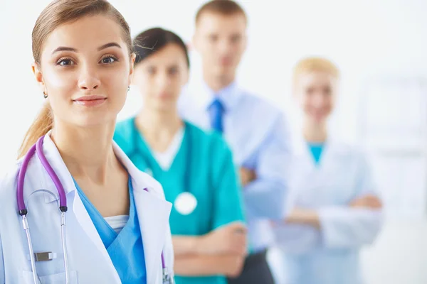 Woman doctor standing with stethoscope at hospital — Stock Photo, Image