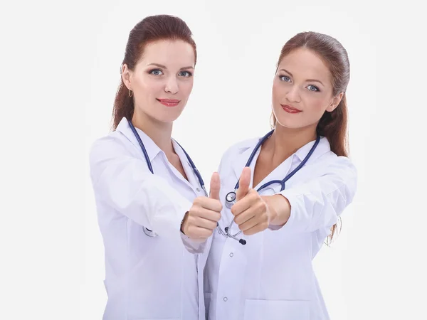 Two young woman doctor showing ok , standing in hospital — Stock Photo, Image