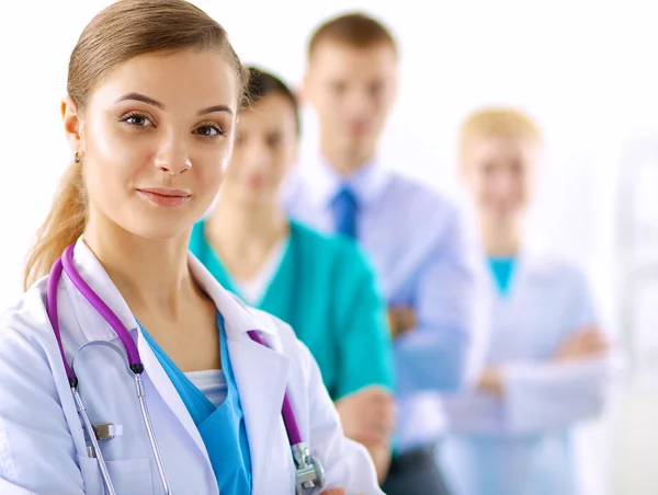 Woman doctor standing with stethoscope at hospital — Stock Photo, Image